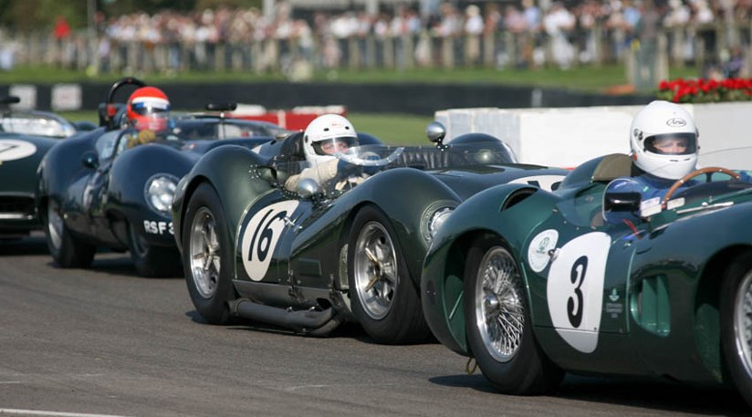 Jamie McIntyre in a sandwich at the chicane between back marker Aston DBR1 and hot pursuer Mark Hales in the Lister Jagaur Costin